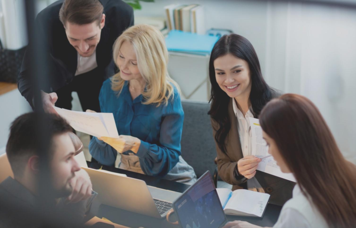 Participants engaged in collaborative financial literacy workshop session